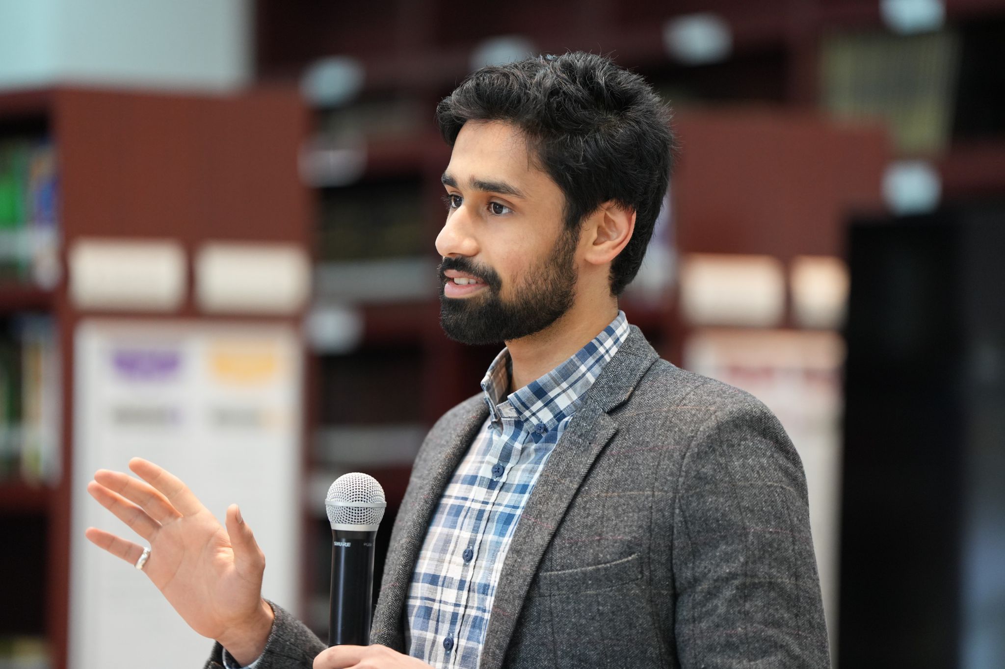 Mohamed Alsadadi speaking at an event